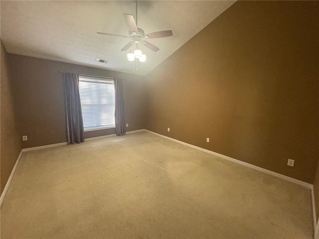 3452 Morning Top Place Suwanee, GA 30024 - Photo 19 of 33 an empty room with a chandelier fan