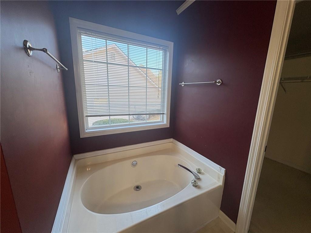 3452 Morning Top Place Suwanee, GA 30024 - Photo 21 of 33 a bathroom with a bathtub