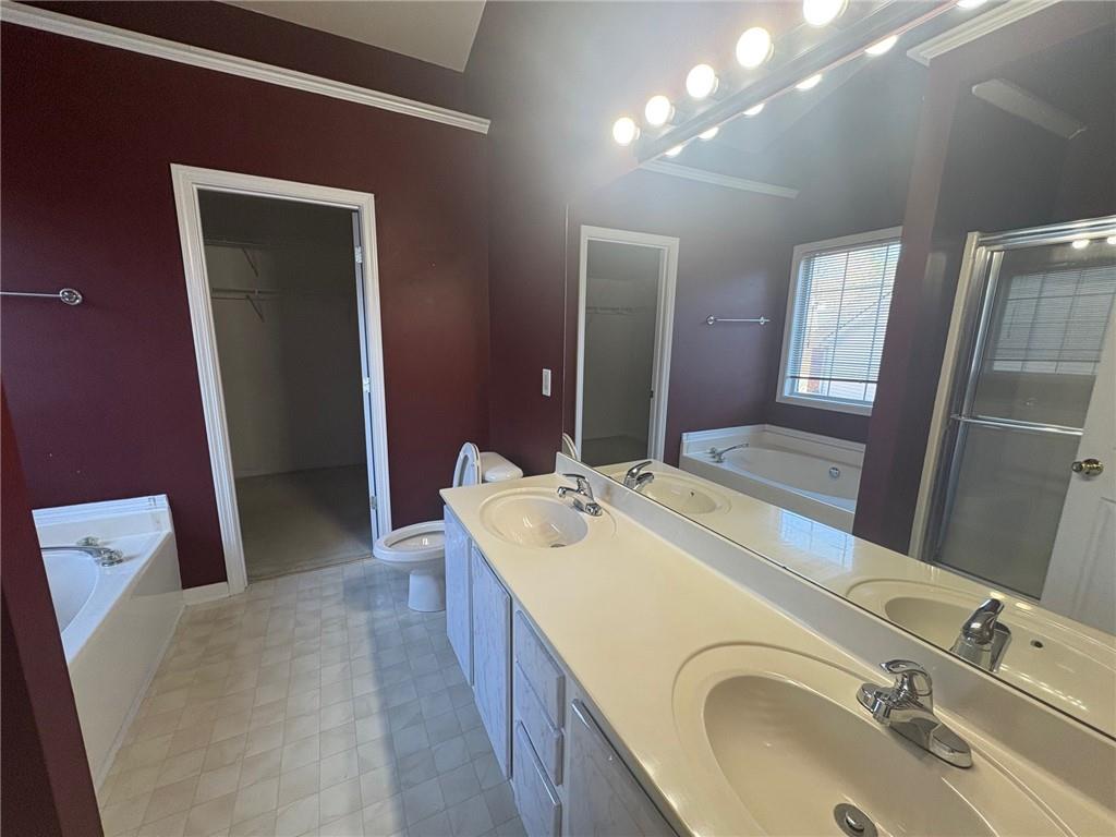 3452 Morning Top Place Suwanee, GA 30024 - Photo 22 of 33 a en suite bathroom with a granite countertop sink and a mirror