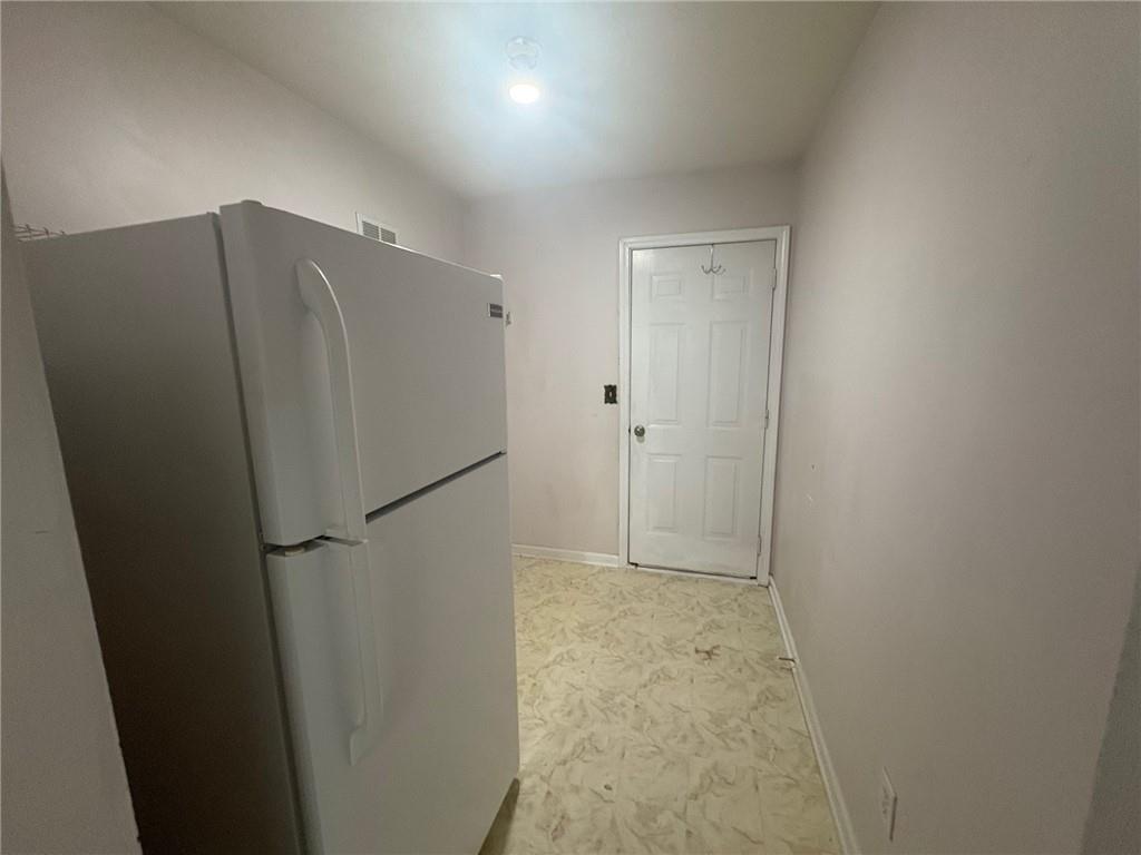 3452 Morning Top Place Suwanee, GA 30024 - Photo 32 of 33 a view of a refrigerator in kitchen