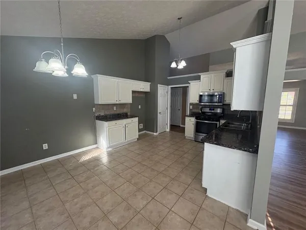 a large kitchen with cabinets