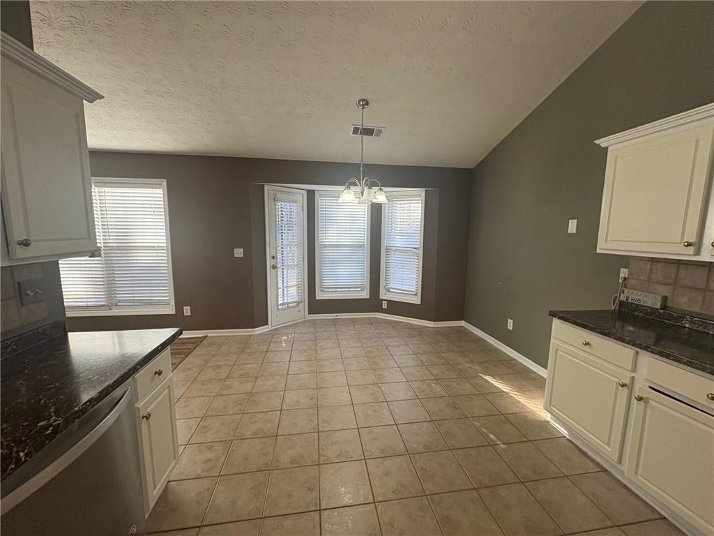 3452 Morning Top Place Suwanee, GA 30024 - Photo 10 of 33 a open kitchen with granite countertop a stove sink and cabinets