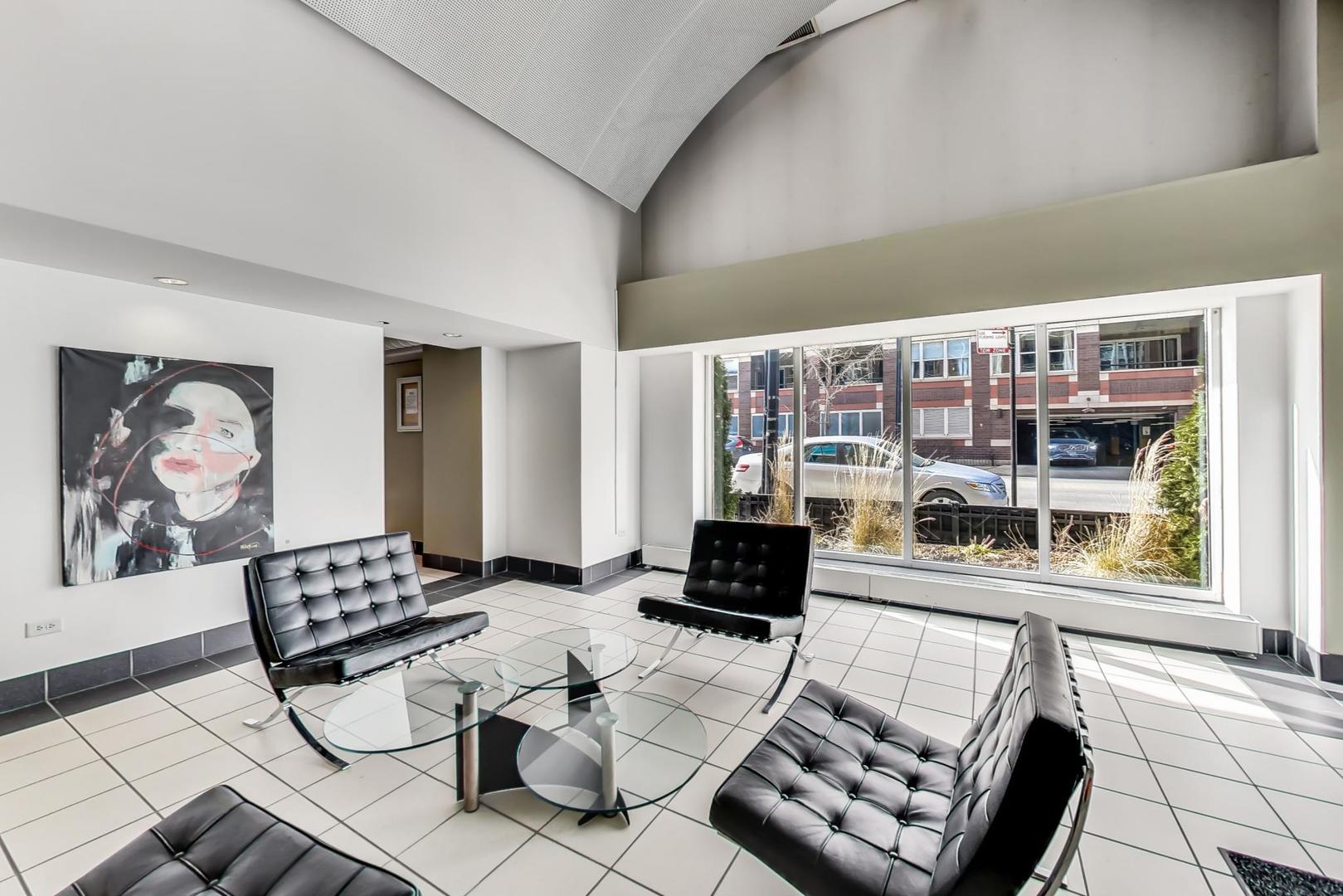 111 South Morgan Street, Unit 522 Chicago, IL 60607 - Photo 7 of 37 a living room with furniture and a floor to ceiling window