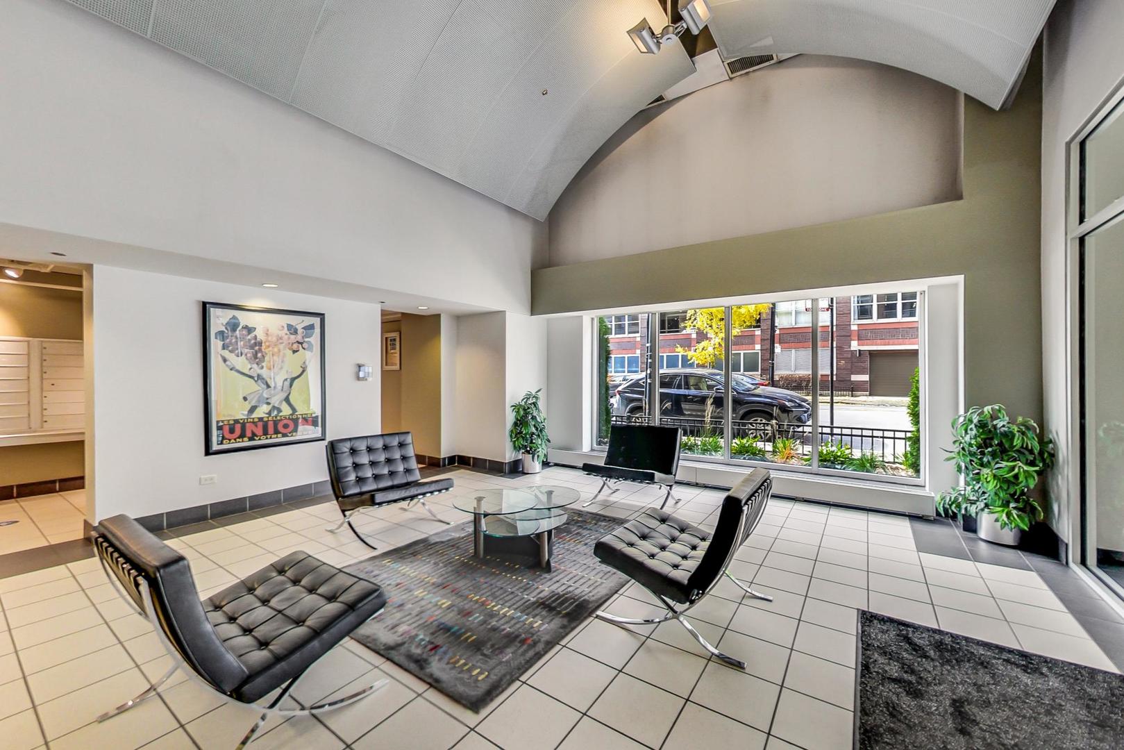 111 South Morgan Street, Unit 522 Chicago, IL 60607 - Photo 8 of 37 a living room with furniture and a floor to ceiling window