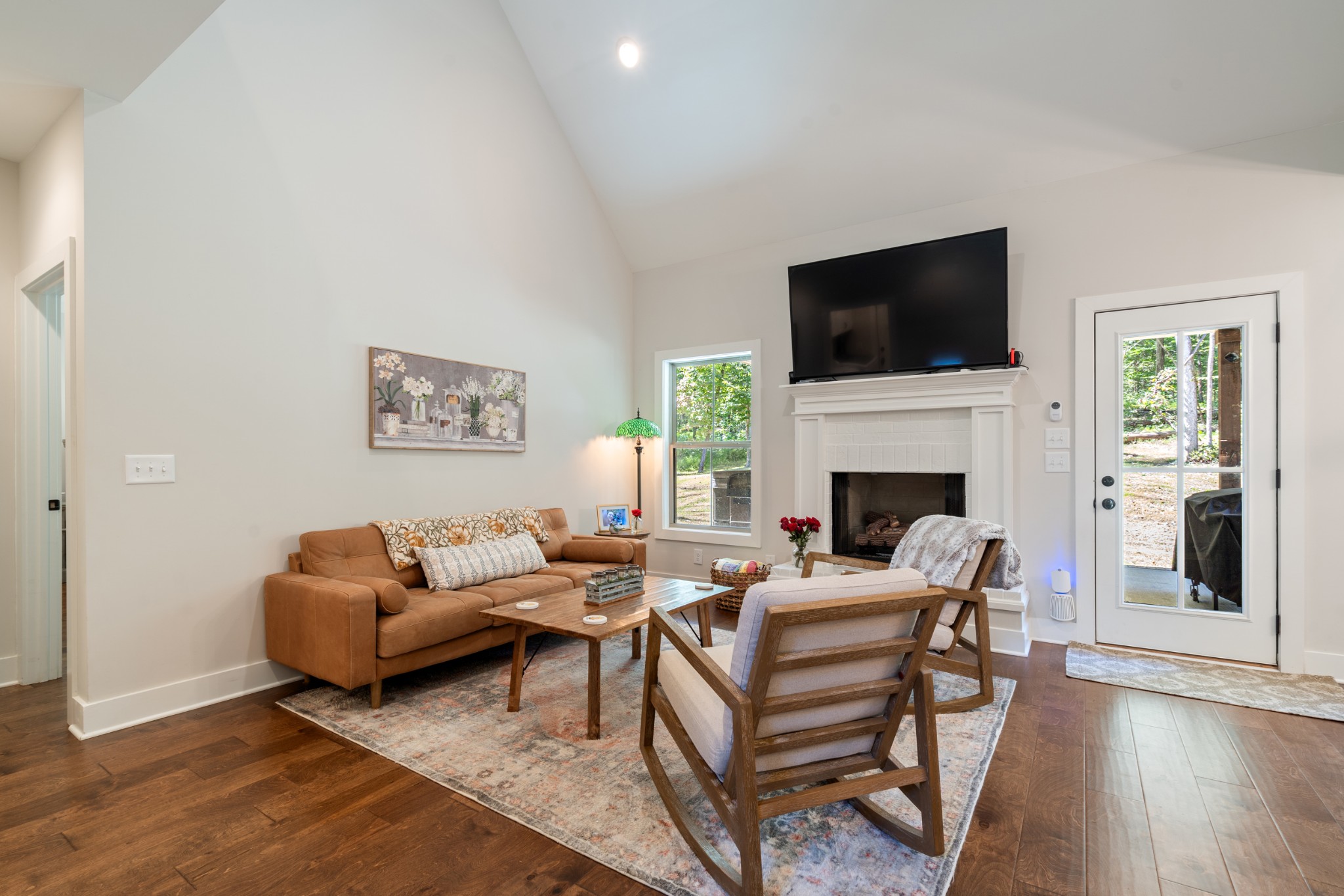 659 Turney Road Auburntown, TN 37016 - Photo 11 of 40 a living room with furniture a flat screen tv and a fireplace