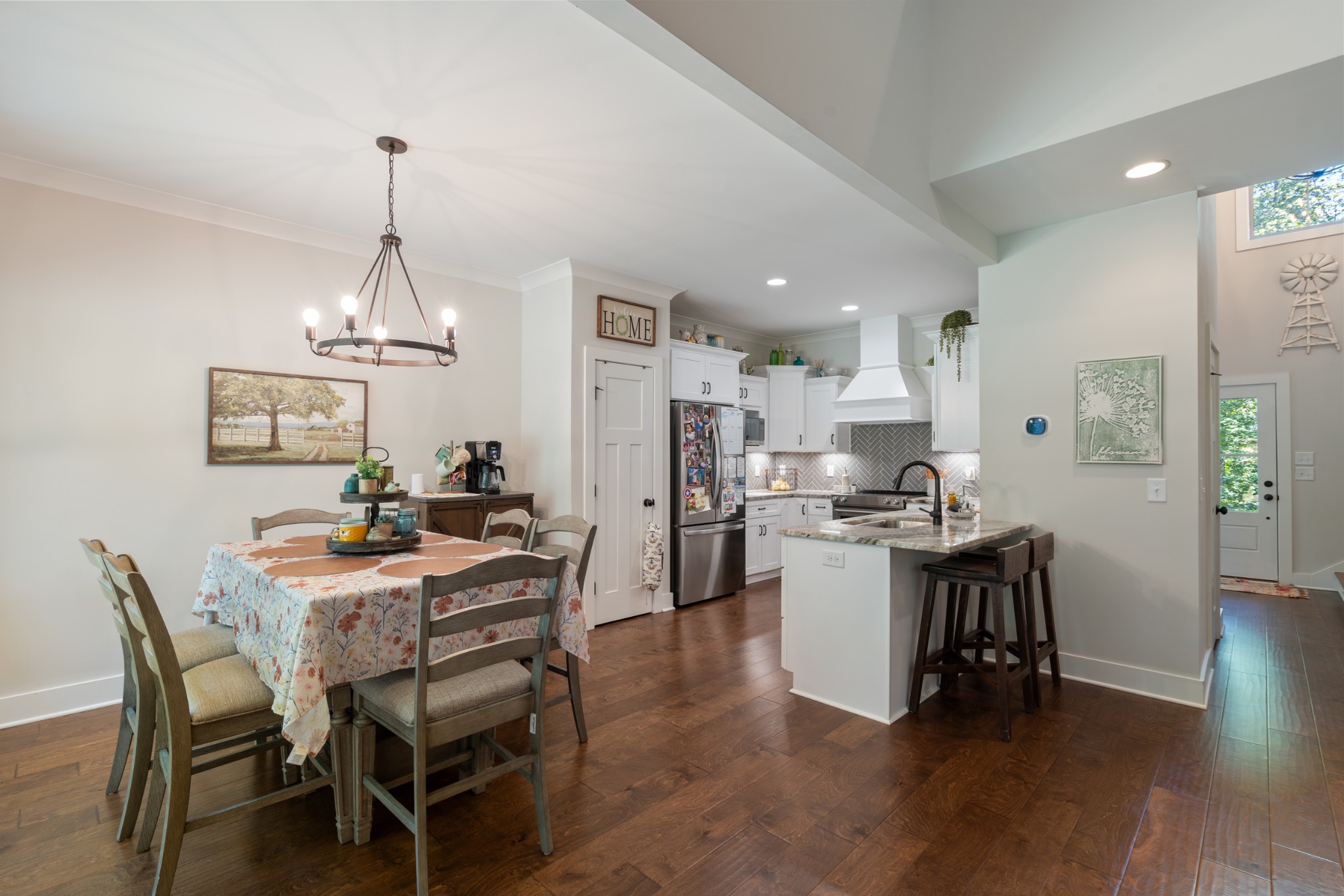 659 Turney Road Auburntown, TN 37016 - Photo 14 of 40 a kitchen with a dining table chairs and wooden floor