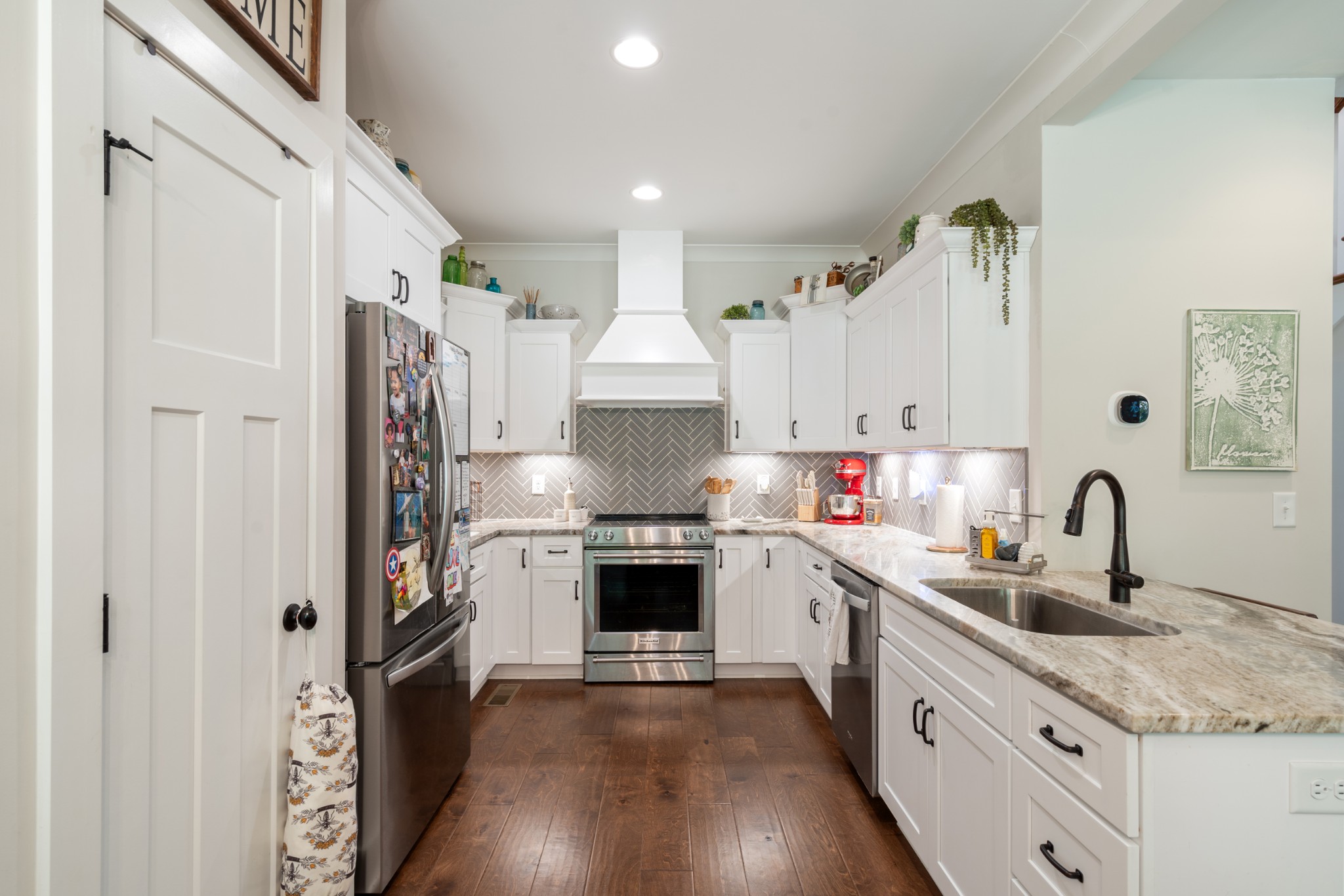 659 Turney Road Auburntown, TN 37016 - Photo 15 of 40 a kitchen with refrigerator a sink and cabinets