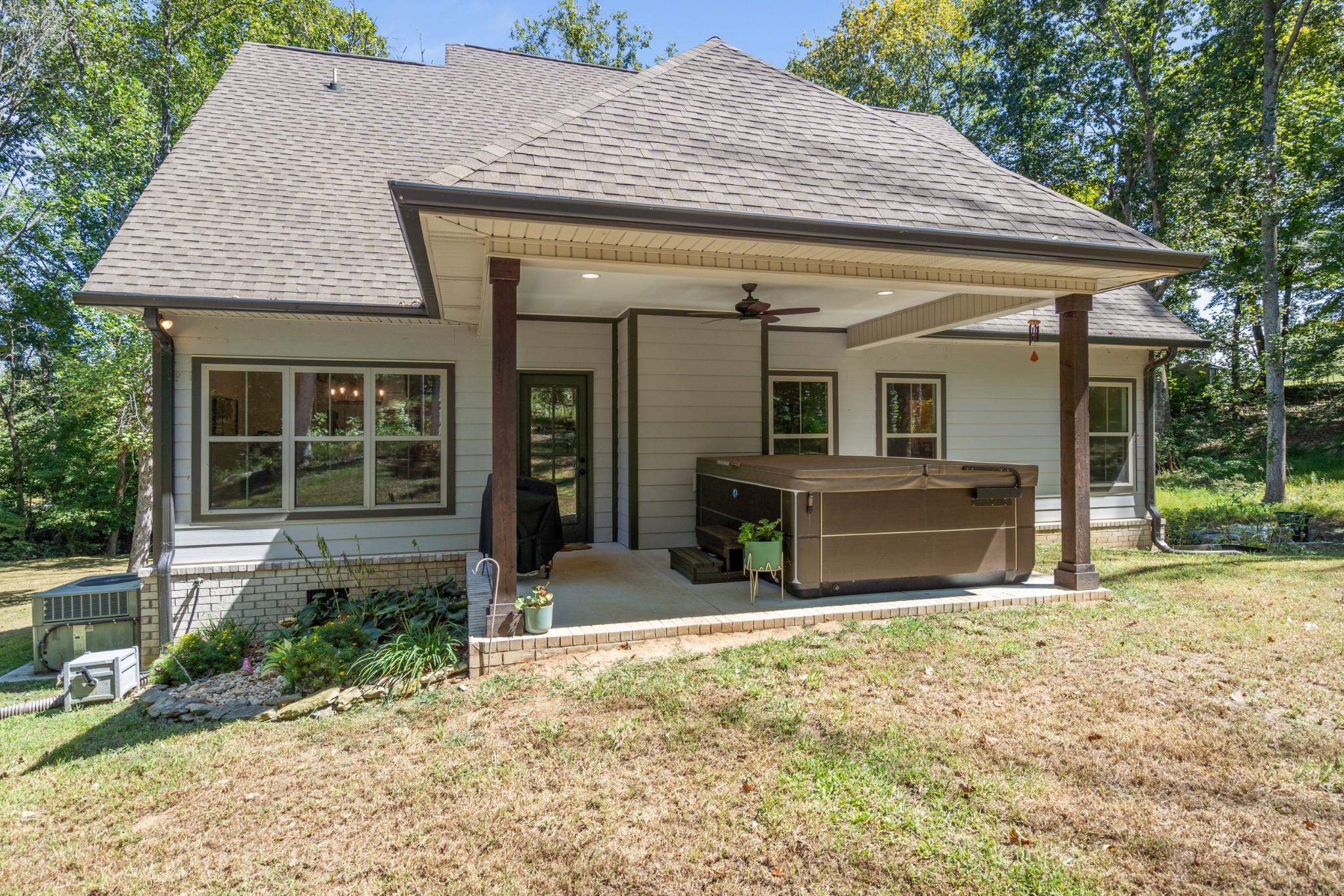 659 Turney Road Auburntown, TN 37016 - Photo 18 of 40 a view of a house with a tub and chairs next to a yard
