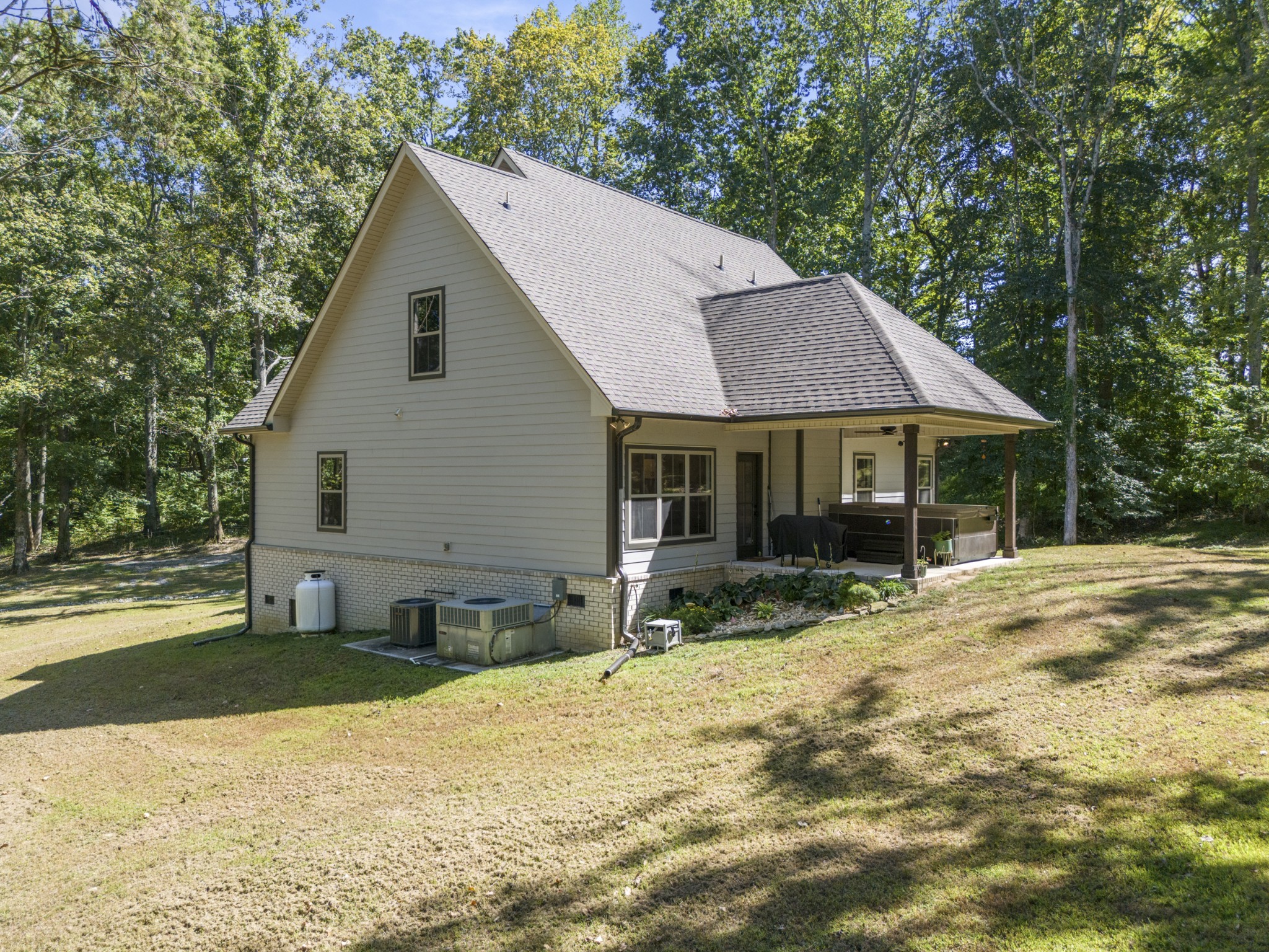 659 Turney Road Auburntown, TN 37016 - Photo 19 of 40 a view of a house with a yard and sitting area