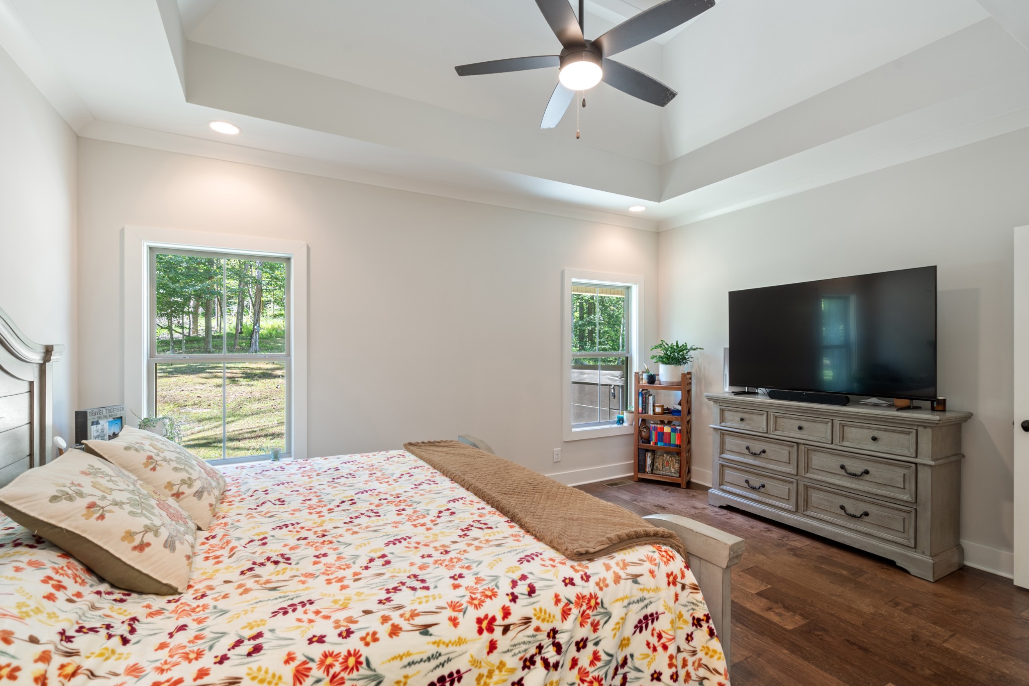 659 Turney Road Auburntown, TN 37016 - Photo 22 of 40 a bedroom with a bed and a flat screen tv on dresser