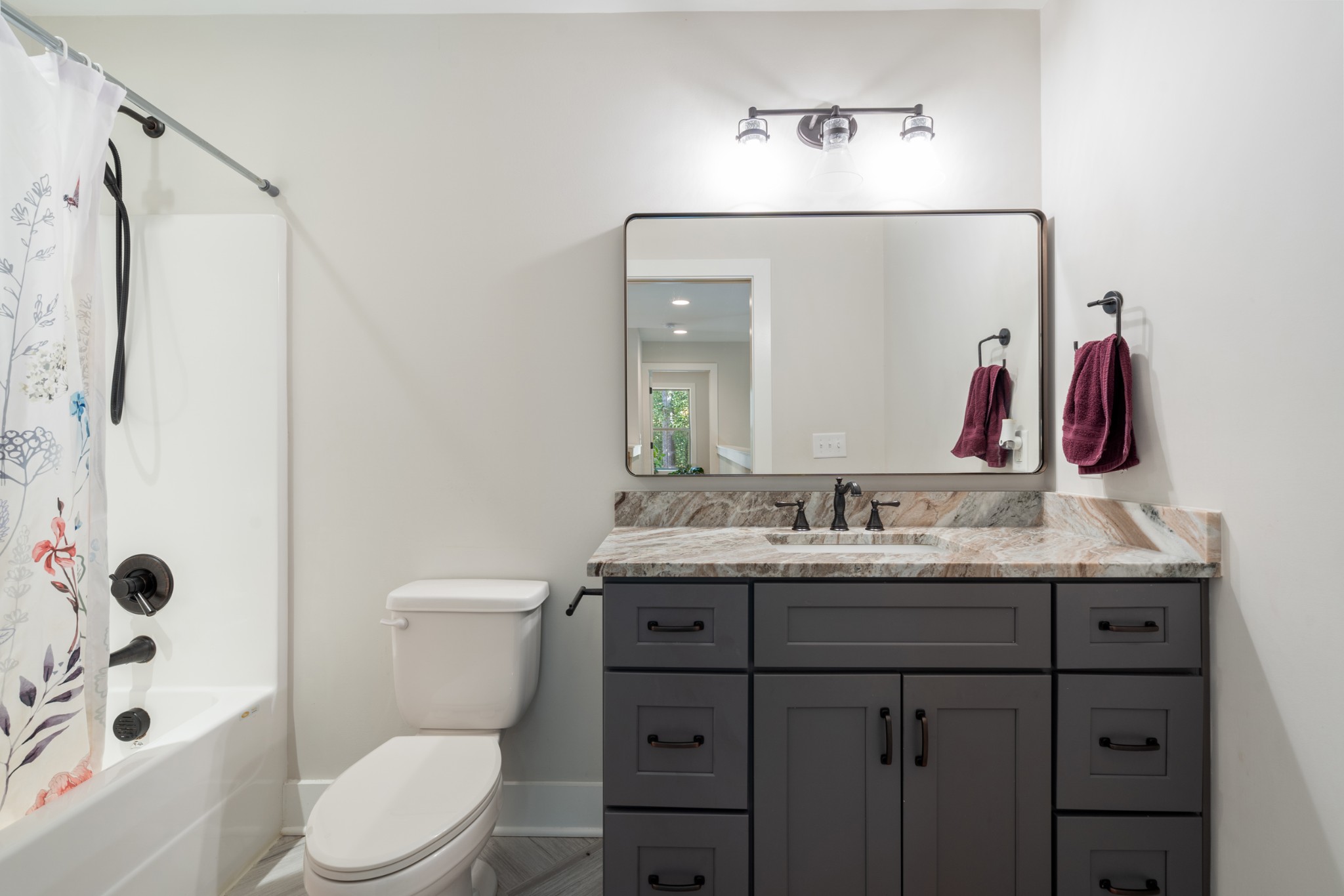 659 Turney Road Auburntown, TN 37016 - Photo 29 of 40 a bathroom with a granite countertop sink a toilet and a mirror