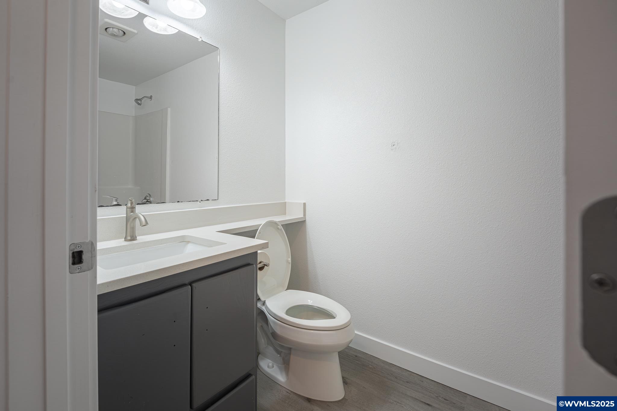 1467 South 7th Street Independence, OR 97351 - Photo 15 of 31 a bathroom with a sink toilet and a mirror