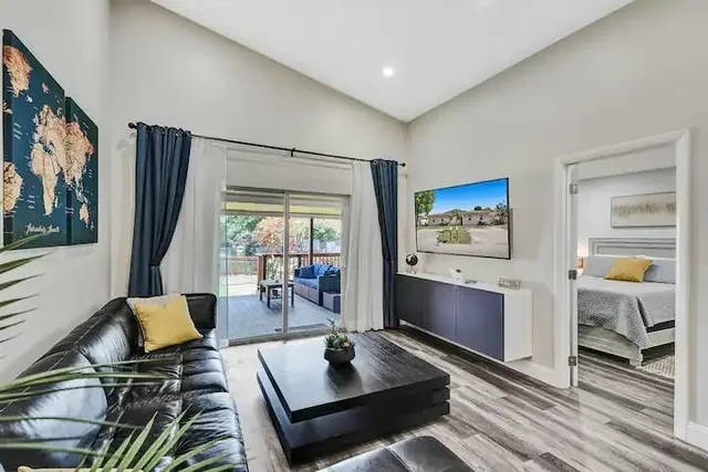 a living room with furniture and a flat screen tv