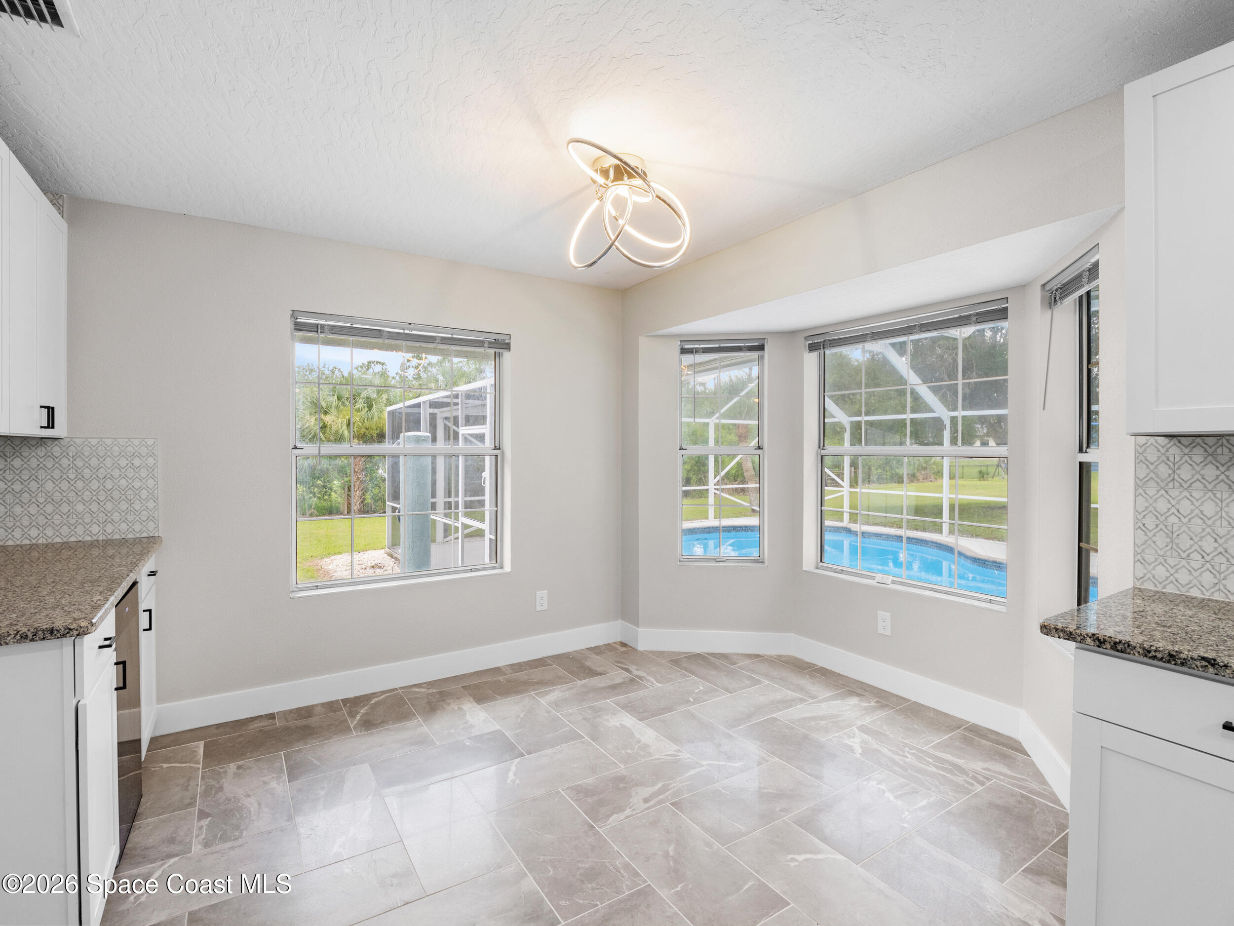 3480 Weber Road Malabar, FL 32950 - Photo 12 of 45 a view of an empty room with a window