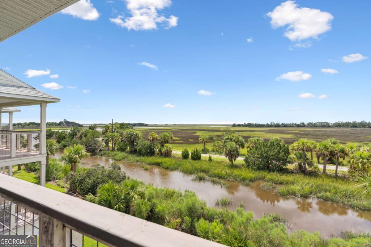 16 Hidden Harbor Road Brunswick, GA 31525 - Photo 13 of 42 a view of a lake with a city
