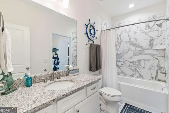 a view of a hallway with furniture