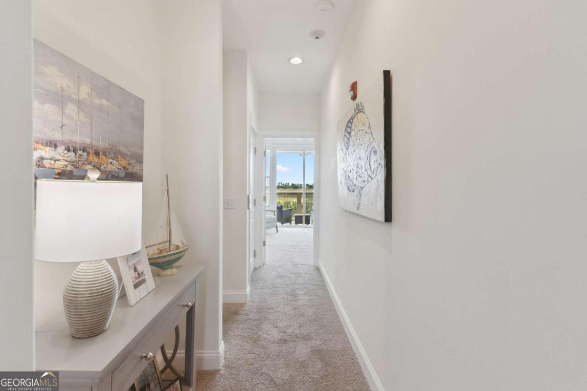 16 Hidden Harbor Road Brunswick, GA 31525 - Photo 22 of 42 a view of a hallway with furniture