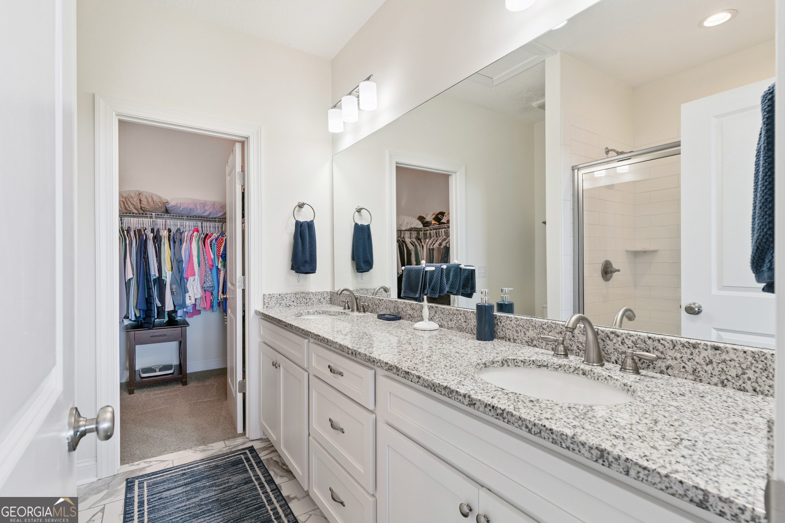 16 Hidden Harbor Road Brunswick, GA 31525 - Photo 25 of 42 a bathroom with a granite countertop double vanity sink and a mirror