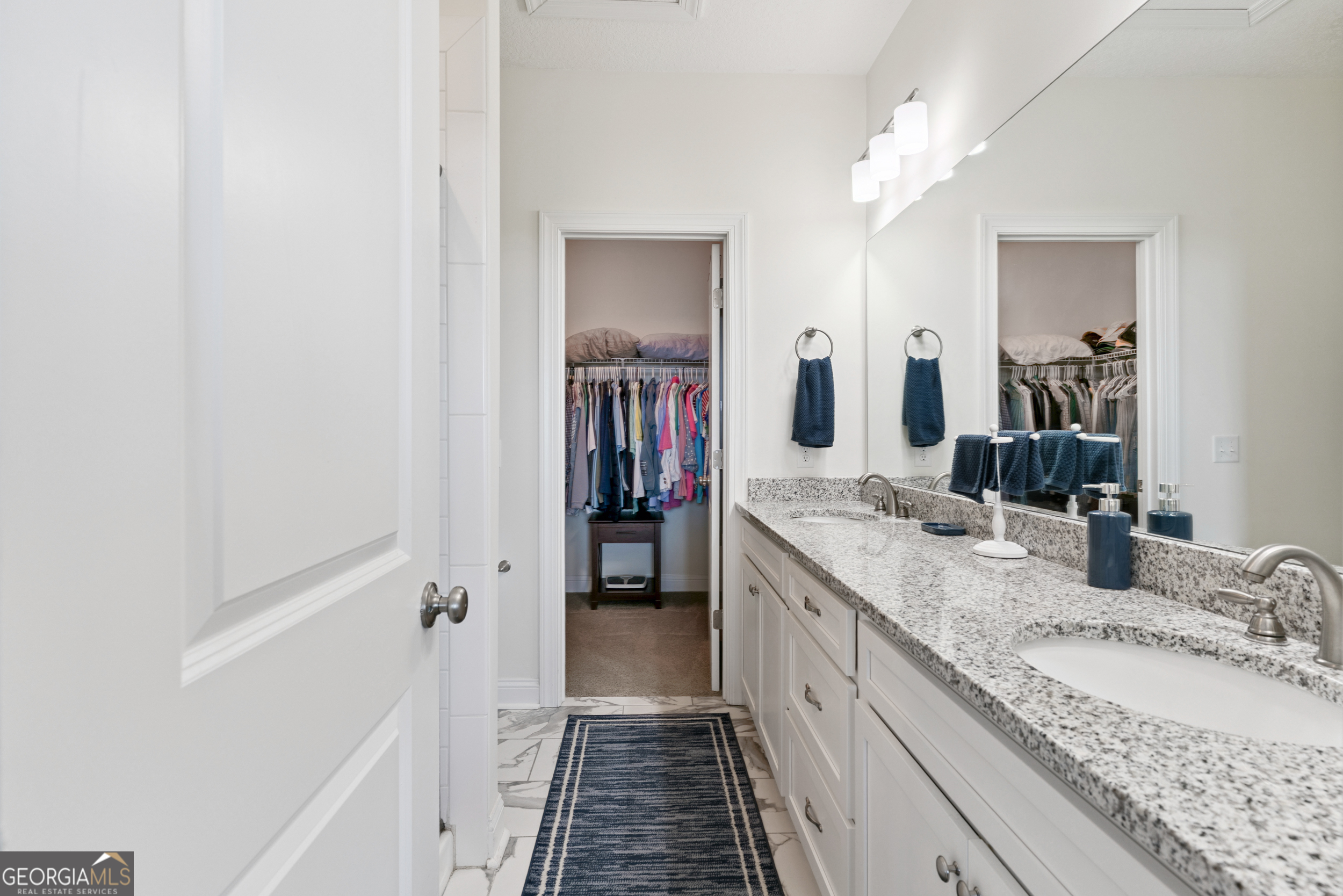 16 Hidden Harbor Road Brunswick, GA 31525 - Photo 27 of 42 a bathroom with a granite countertop double vanity sink and mirror