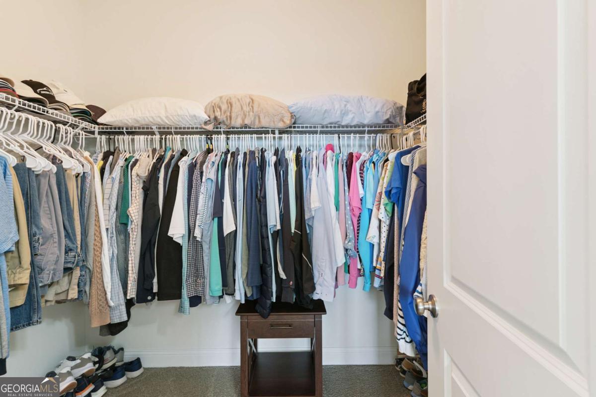 16 Hidden Harbor Road Brunswick, GA 31525 - Photo 28 of 42 a view of walk in closet with clothes and shoes