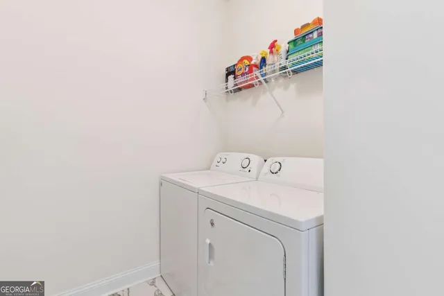 an aerial view of a house with swimming pool and lake view