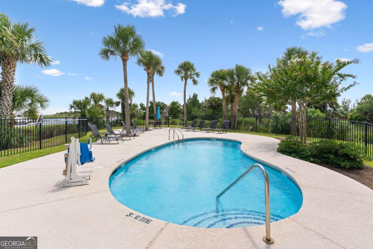16 Hidden Harbor Road Brunswick, GA 31525 - Photo 34 of 42 a view of a swimming pool with a patio