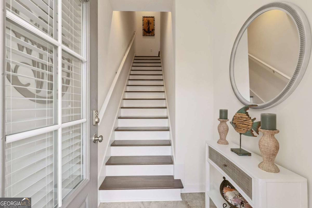 16 Hidden Harbor Road Brunswick, GA 31525 - Photo 7 of 42 a view of a livingroom with an entryway and stairs