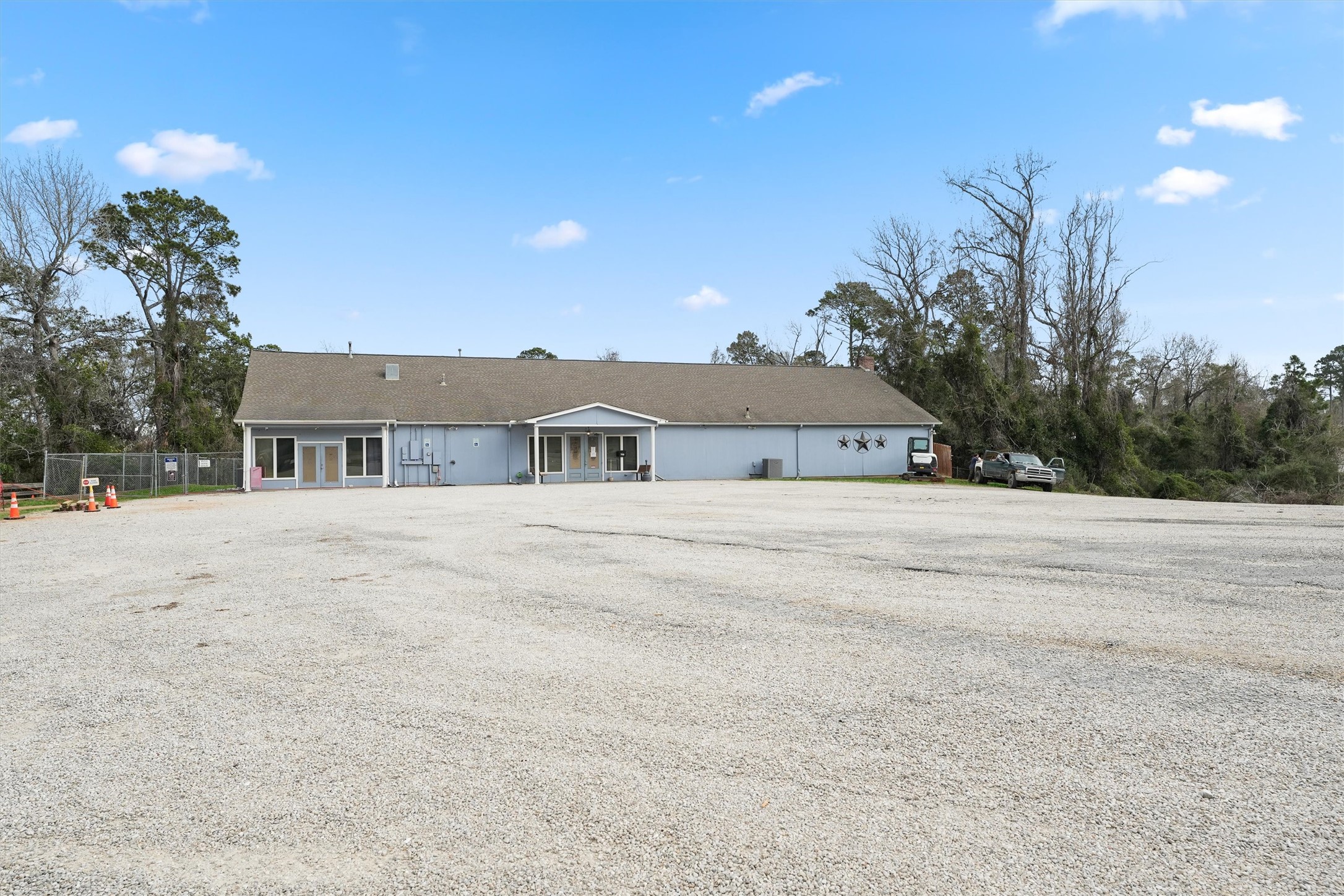231 Monte Carlo Road Point Blank, TX 77364 - Photo 14 of 15 a view of house with a yard and a large tree