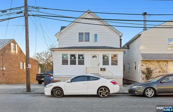 a car parked in front of a house