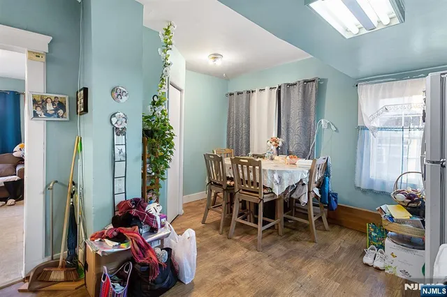 a dining room with furniture and entryway