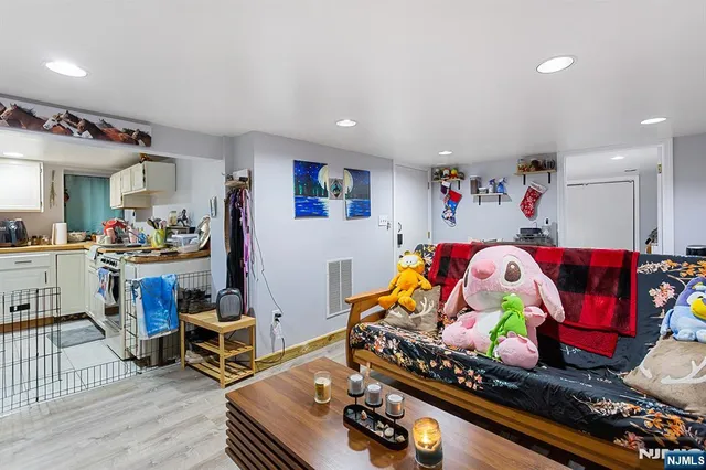 a room with furniture toys and a wooden floor