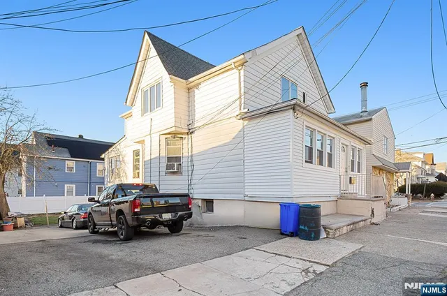 a car parked in front of a house