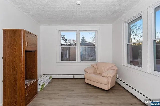 a living room with furniture and windows