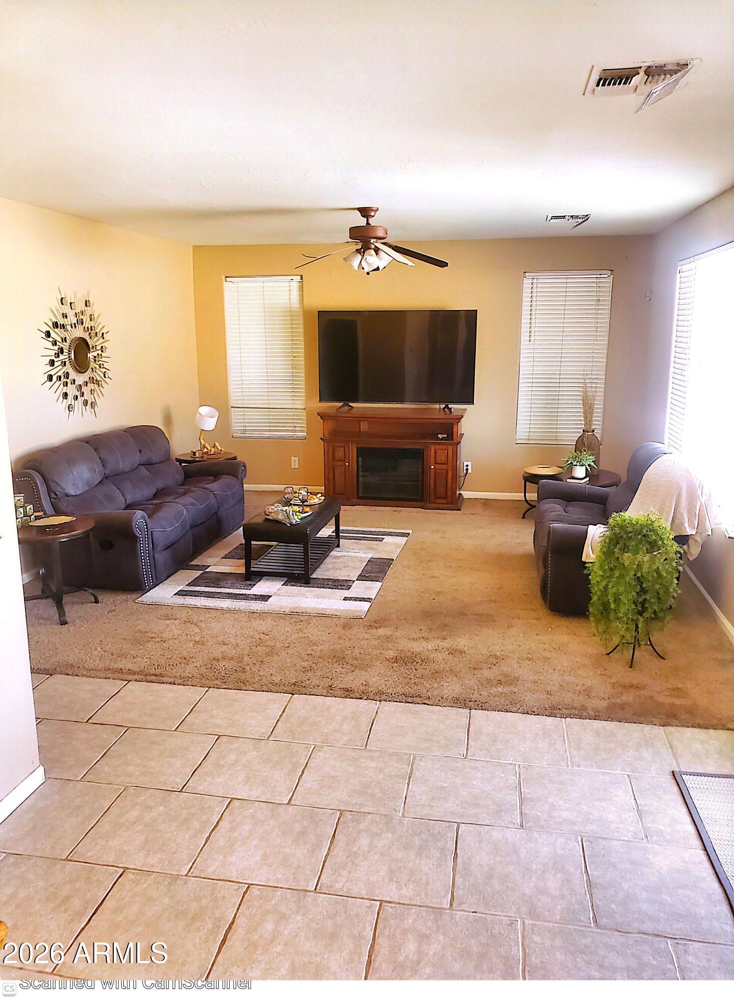 11058 East Cholla Road Mesa, AZ 85207 - Photo 6 of 22 a living room with furniture and a flat screen tv