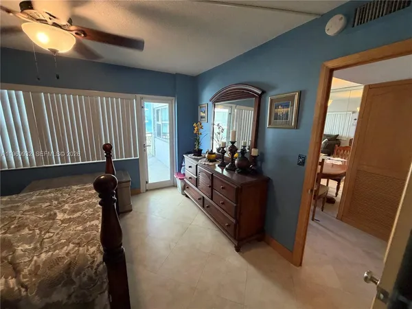 a bathroom with a double vanity sink toilet mirror and shower