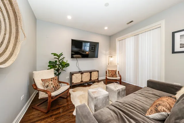 a bedroom with a bed and a television