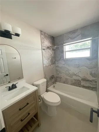 an empty room with a bathroom