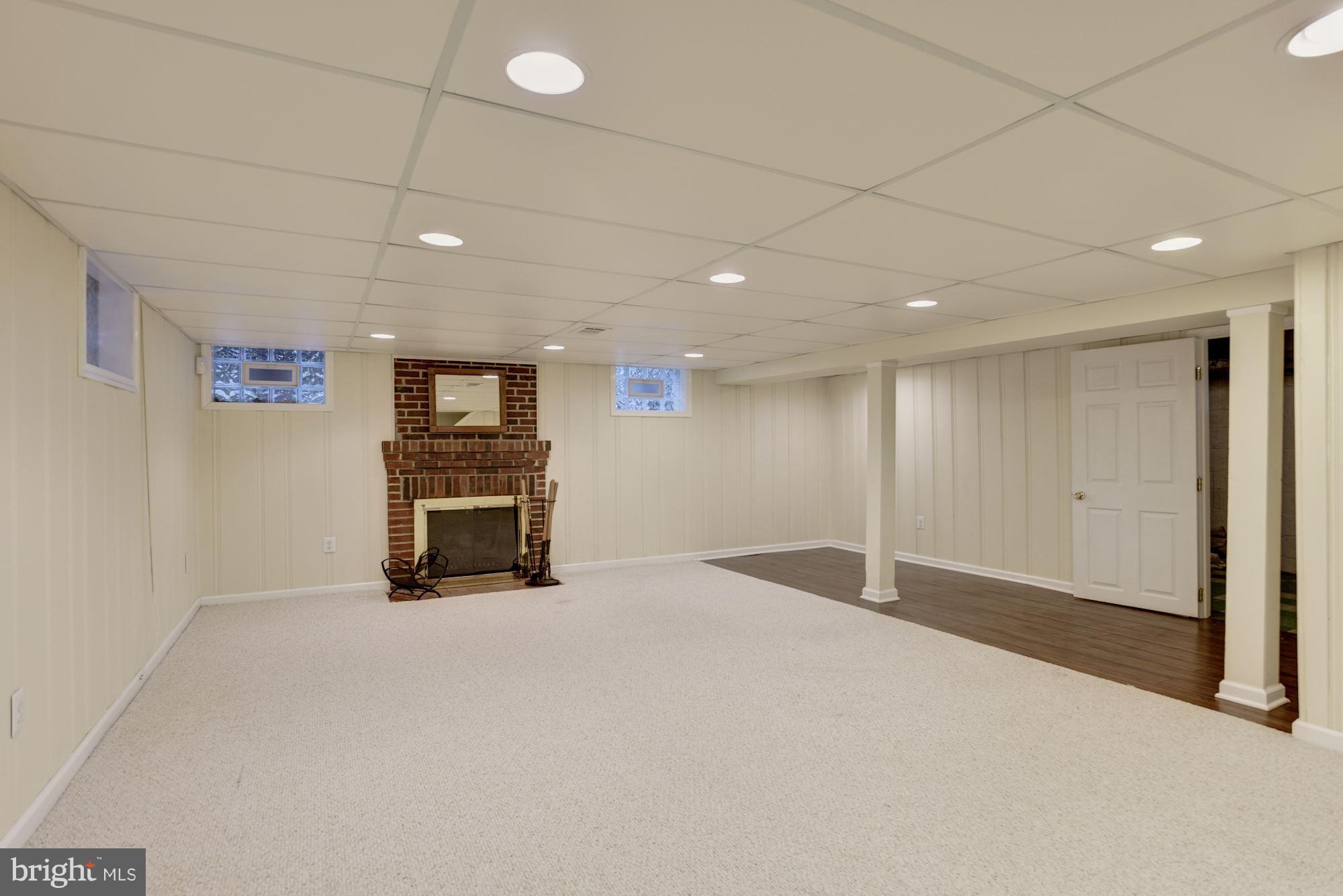 8119 Barksdale Road Baltimore, MD 21286 - Photo 23 of 29 Massive lower level with wood burning fireplace