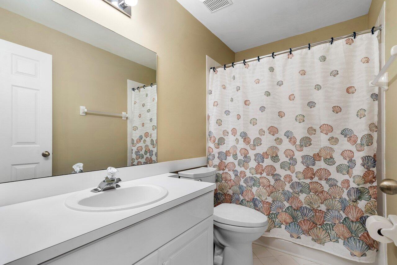 1050 Jeffery Street Boca Raton, FL 33487 - Photo 17 of 25 a bathroom with a sink and a toilet