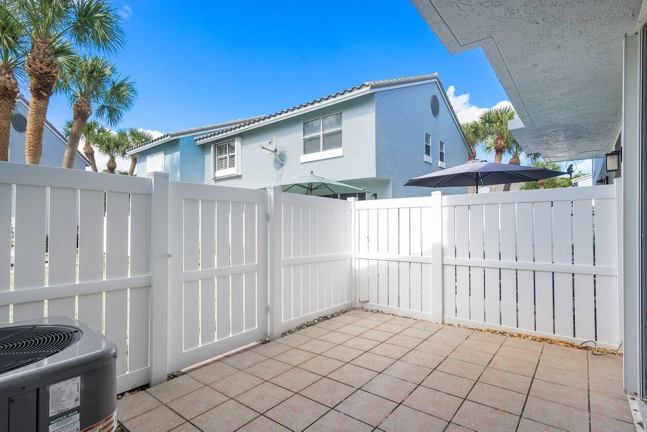 1050 Jeffery Street Boca Raton, FL 33487 - Photo 19 of 25 a view of a house with a backyard