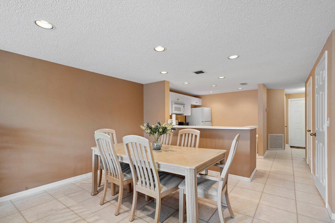 1050 Jeffery Street Boca Raton, FL 33487 - Photo 7 of 25 a view of a dining room with furniture