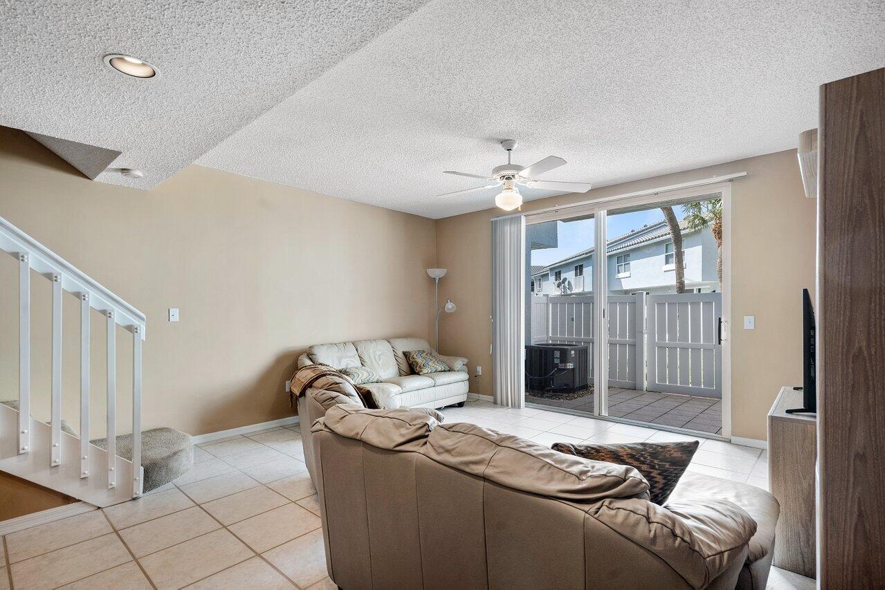 1050 Jeffery Street Boca Raton, FL 33487 - Photo 10 of 25 a living room with furniture and a fireplace