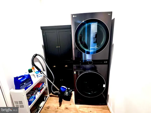 a bedroom with bed and a dresser