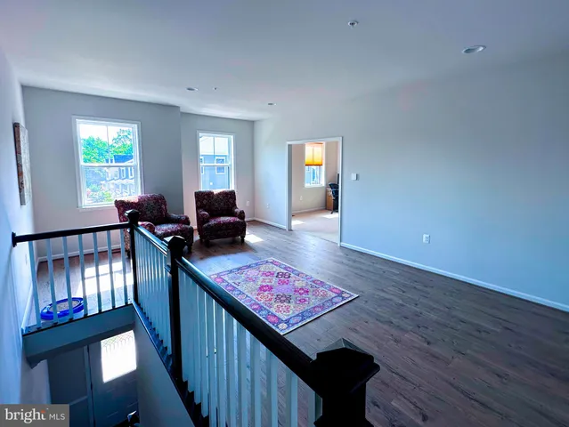 a living room with furniture and rug