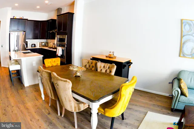 a kitchen with granite countertop a stove a sink and a microwave