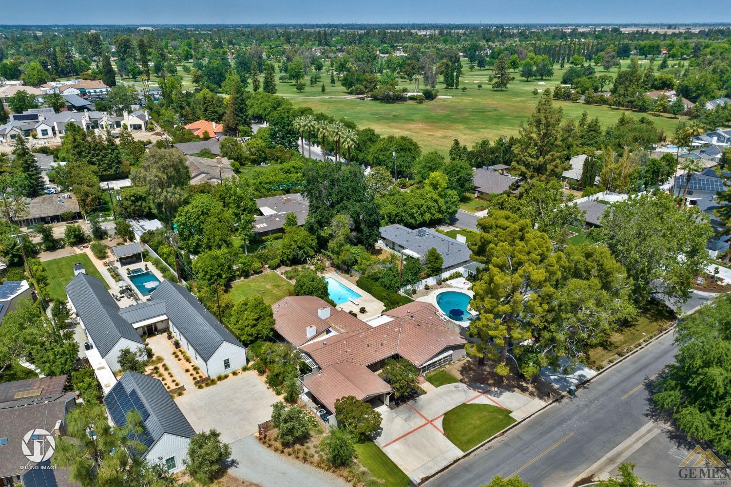 Undisclosed Address Bakersfield, CA 93309 - Photo 2 of 63 an aerial view of residential houses with outdoor space and street view