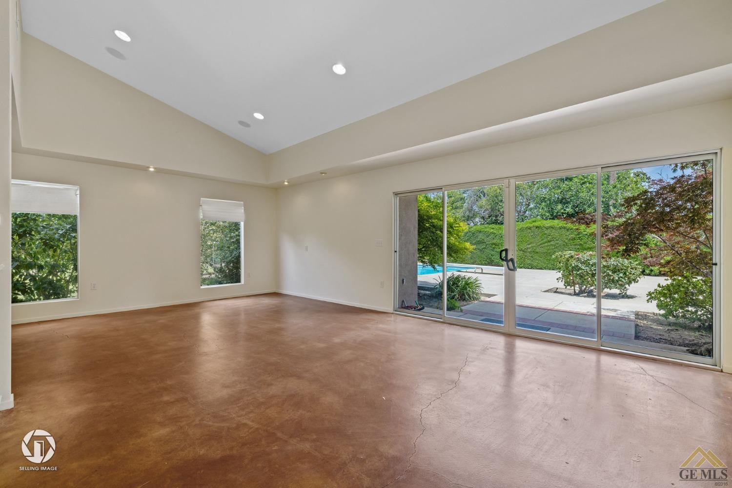 Undisclosed Address Bakersfield, CA 93309 - Photo 34 of 63 a view of an empty room with wooden floor and a window