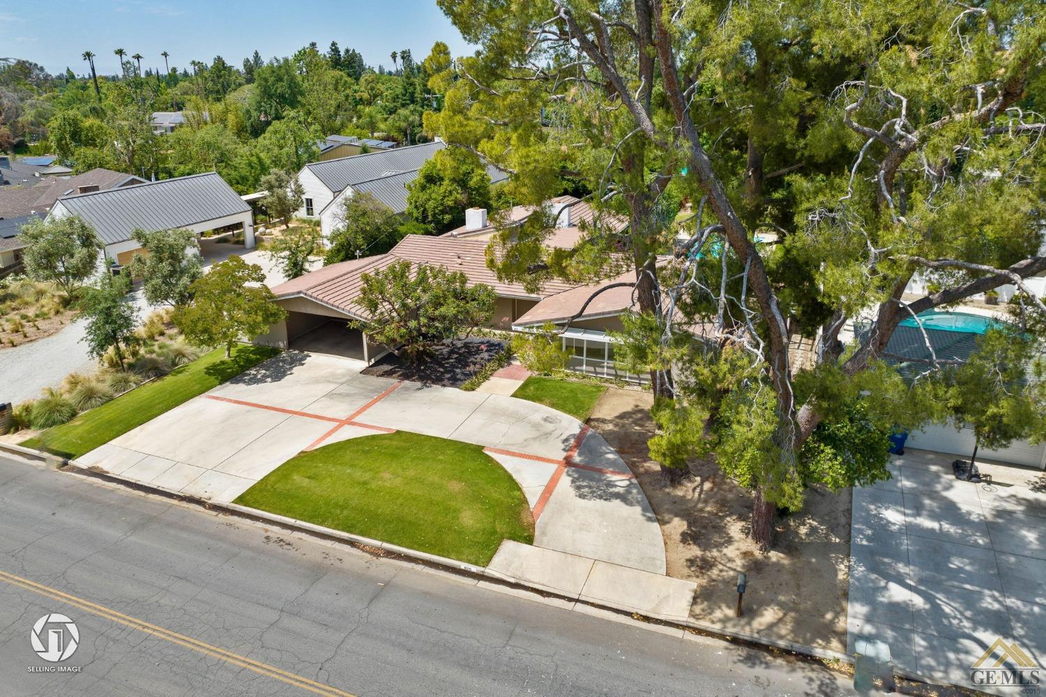 Undisclosed Address Bakersfield, CA 93309 - Photo 4 of 63 an aerial view of a house with yard