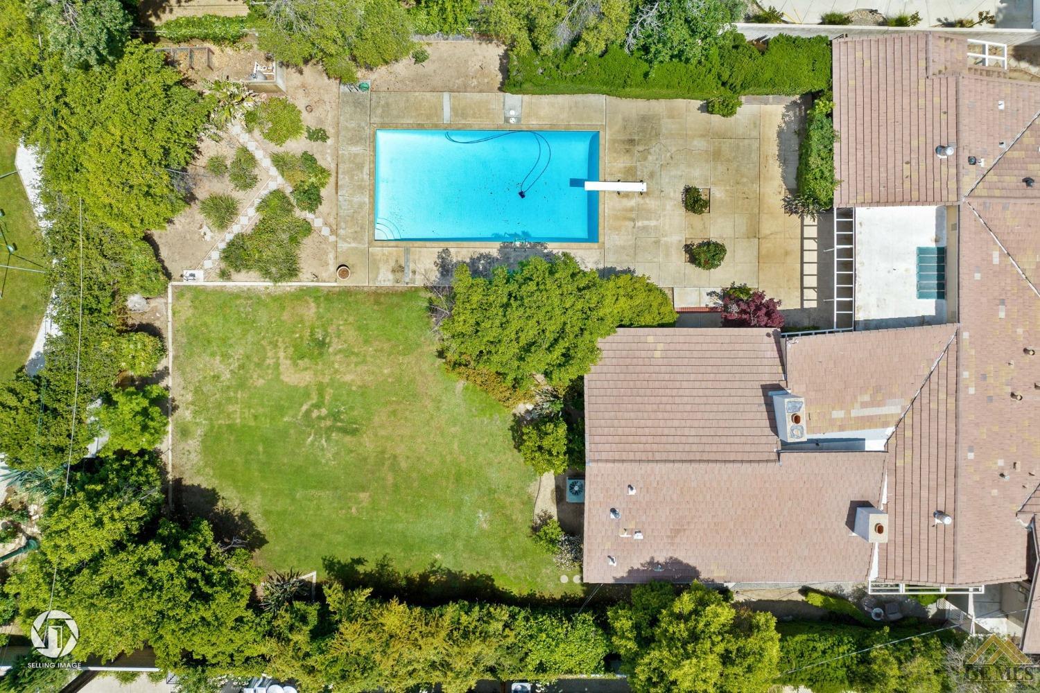 Undisclosed Address Bakersfield, CA 93309 - Photo 60 of 63 an aerial view of residential house with outdoor space and parking
