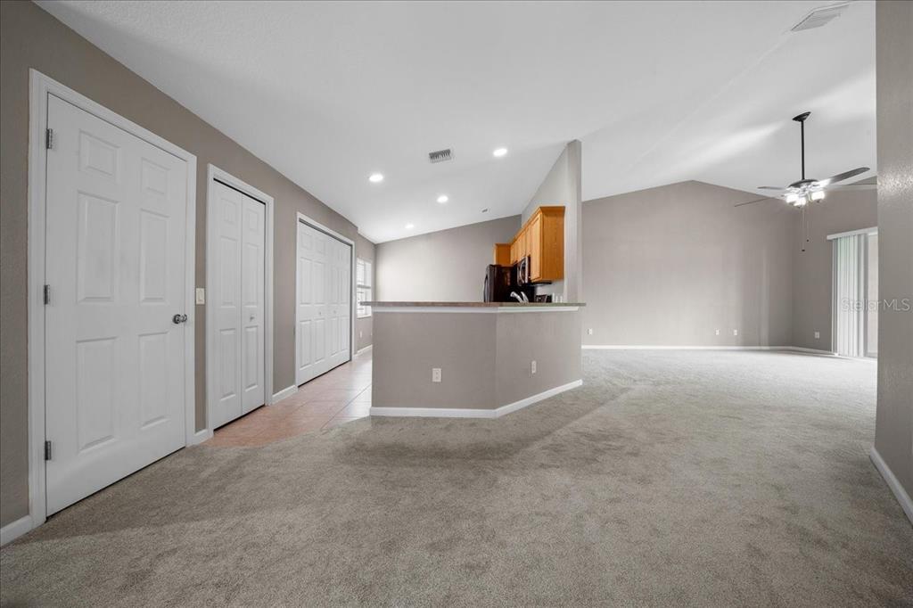 4555 Southwest 52nd Circle, Unit 106 Ocala, FL 34474 - Photo 17 of 100 a view of a kitchen with a sink and a refrigerator